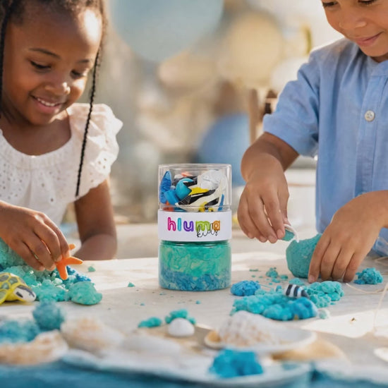 Hluma Kids Waves and Wonders Wonder Jar product video, kids playing with sea-creature figures and teal playdough